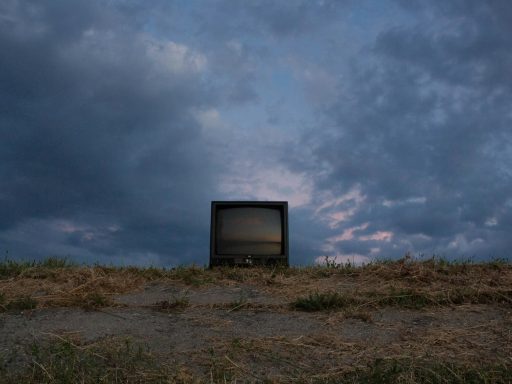 black CRT television on soil