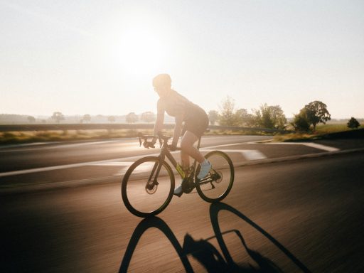 man riding bicycle on road during daytime