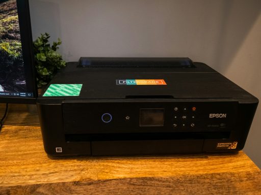 black canon printer on brown wooden table