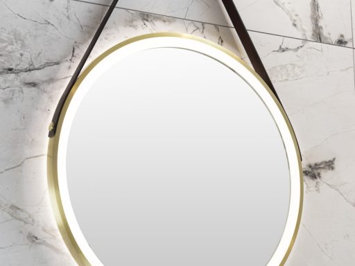 a round mirror hanging on the wall above a sink